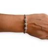 Brazalete rígido con bolas de estrás y cobre
