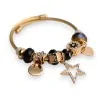 Bracelete rígido dourado e preto com pingente de estrela