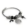 Silver and black rigid charm bracelet with tree of life