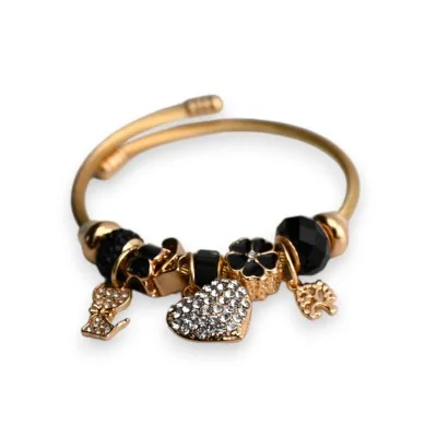 Bracciale rigido con charm nero e oro con cuore in strass