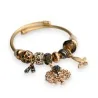 Bracciale rigido con charm dorato e grigio albero della vita