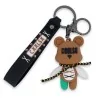 Porte-clés ourson COOLSO marron et vert avec lanière noire