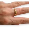 Anillo de acero dorado nudo
