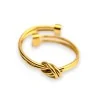 Anello Nodo Dorato in Acciaio | Design Elegante & Regolabile | Moda Trendy