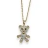 Lange vergoldete Modeschmuck-Halskette mit kleinem beweglichem Teddybär und Strasssteinen