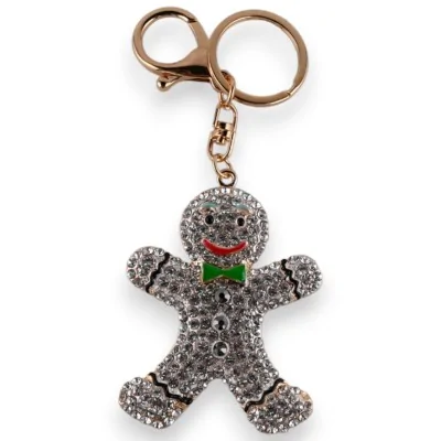 Chaveiro dourado de boneco de biscoito