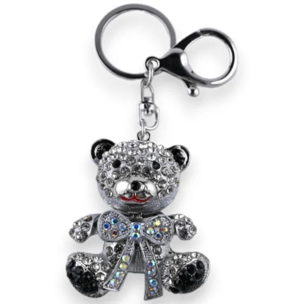 Silberner Schlüsselanhänger mit Teddybär und weißer Schleife