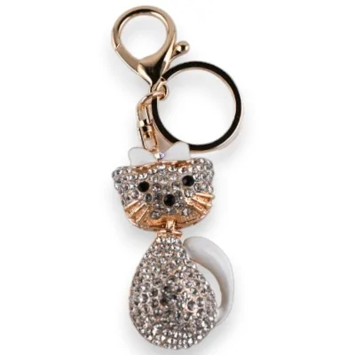 Chaveiro dourado de gato sentado