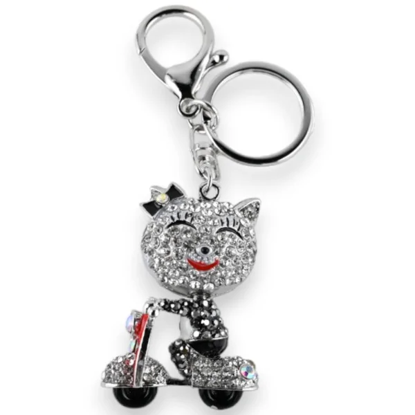Llavero plateado con pequeño gato en scooter