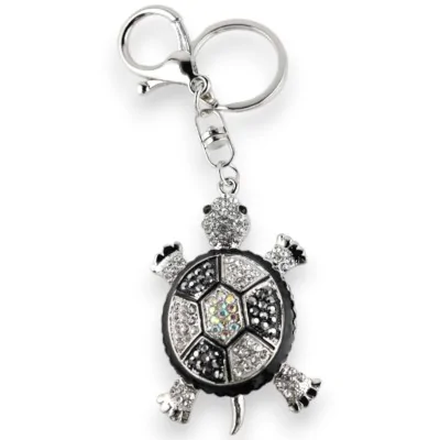 Silver keychain with black and white rhinestone turtle