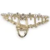 Presilha de cabelo dourada com 3 flores de strass