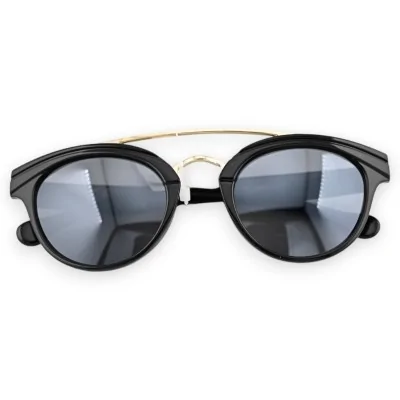 Runde Designer-Brille in Schwarz mit goldenem Quersteg Runde Designer-Brille in Schwarz mit goldenem Quersteg