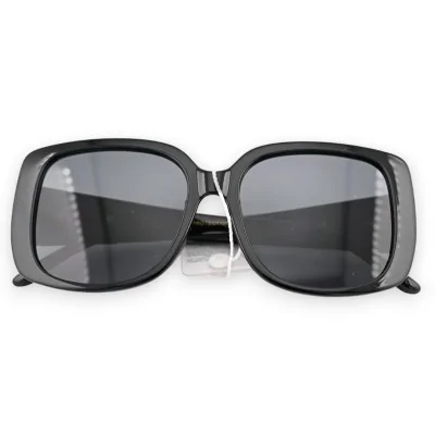 Large black sunglasses with gold finishes