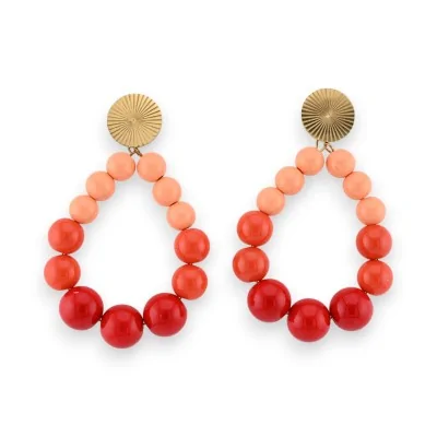 Hoop earrings with shiny orange-toned pearls