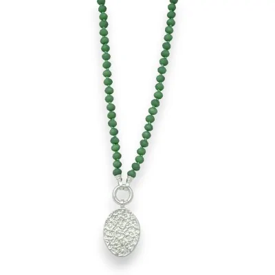 Fantasy necklace with green pearls and brushed silver medallion