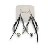 Black feather earrings by Ikita