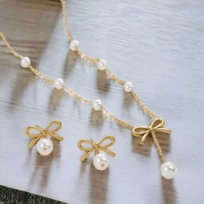 Parure acier doré Collier...