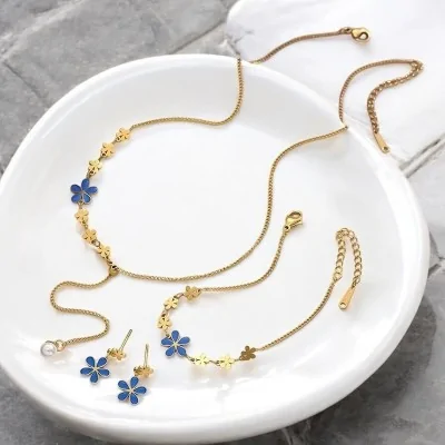 Parure bijoux acier doré...