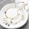 Gold-plated steel jewelry set with blue flowers