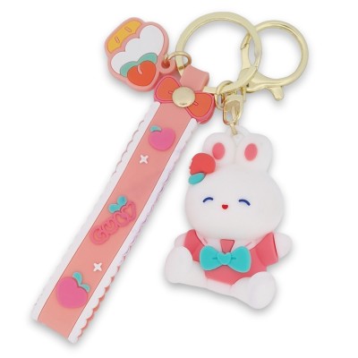 Porte-clés lapin blanc au nœud turquoise avec lanière rose