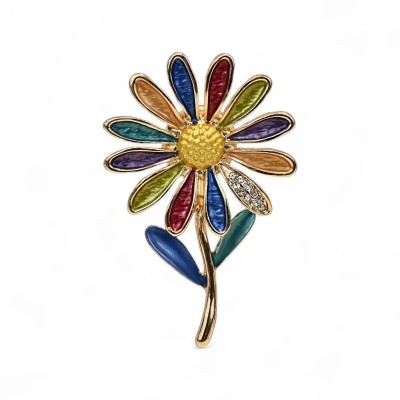 Rainbow daisy brooch with twelve enamel petals in royal blue, olive green, deep purple, red, turquoise and peach, one clear crys