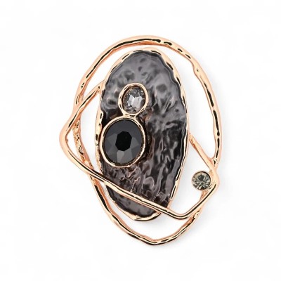 Vorderansicht der Roségold Skulpturbrosche, gehämmerter Anthrazit-Oval-Stein mit drei facettierten Kristallen und zwei modellier