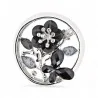 Art nouveau medallion brooch front view, pearl white round rim with silver inner outline, openwork scene with black enamel flowe