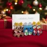 Set of 3 acrylic Christmas earrings on Fashion Jewelry card: caramel reindeer with red and white striped scarf and gold star stu