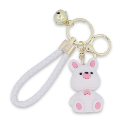 Porte-clés lapin blanc et rose avec lanière tressée et grelot